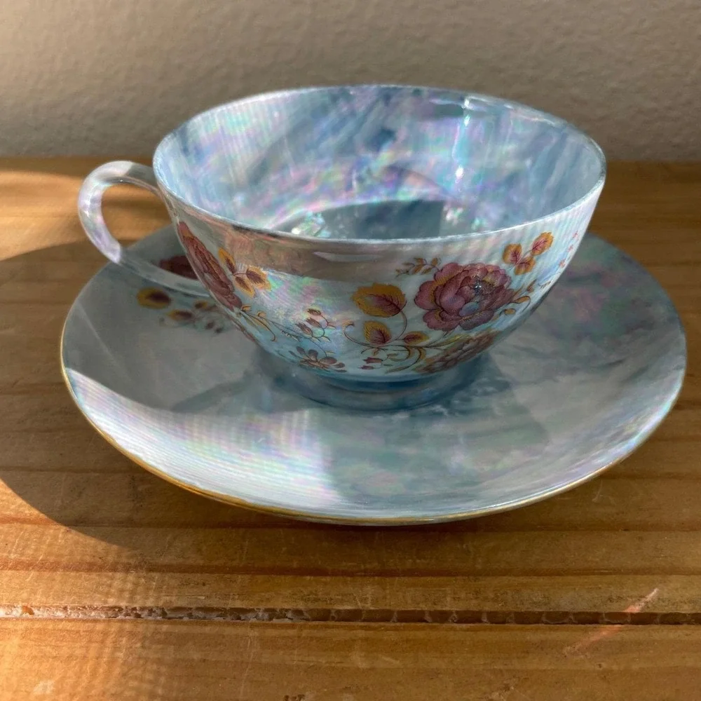 Vintage Blue Iridescent Teacup and Saucer Thomas Germany Lustreware Floral‎